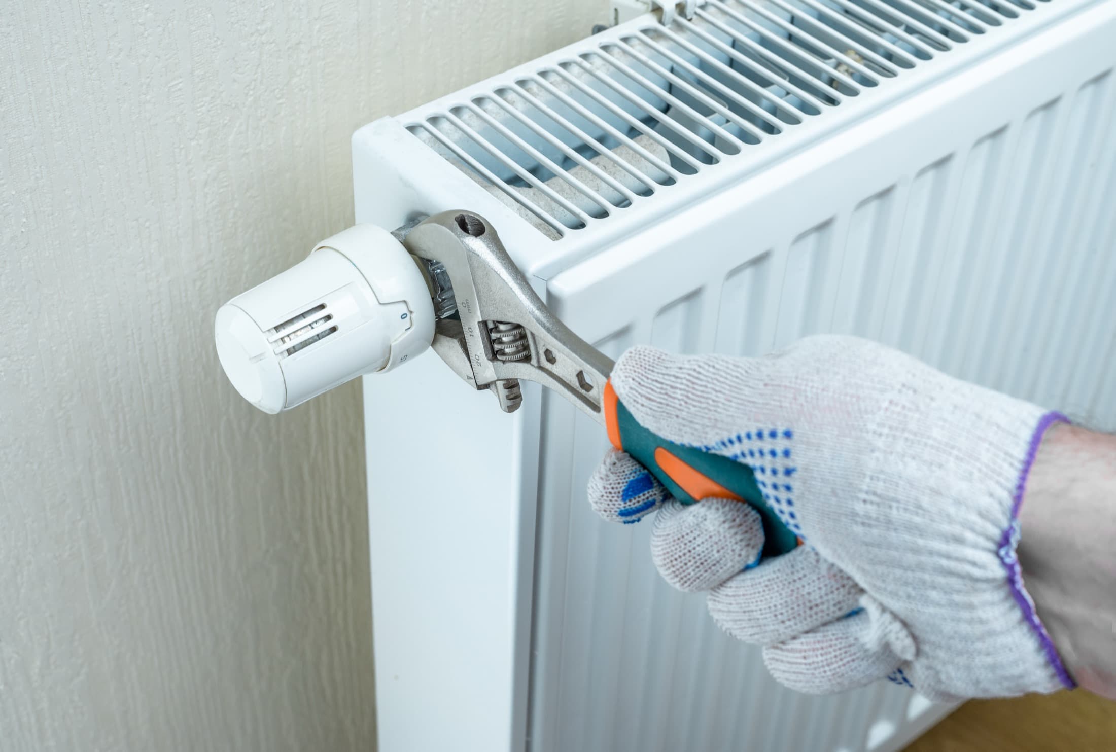 Technician servicing an indoor heating and air system